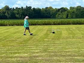 May be an image of golf, frisbee, golf course and grass
