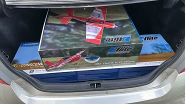 May be an image of rearview mirror, car and text