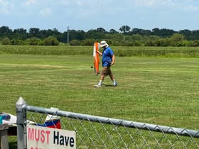 May be an image of aircraft, frisbee and grass