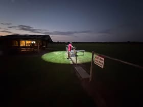 May be an image of bicycle and grass