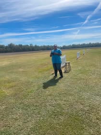 May be an image of skeet shooting and grass